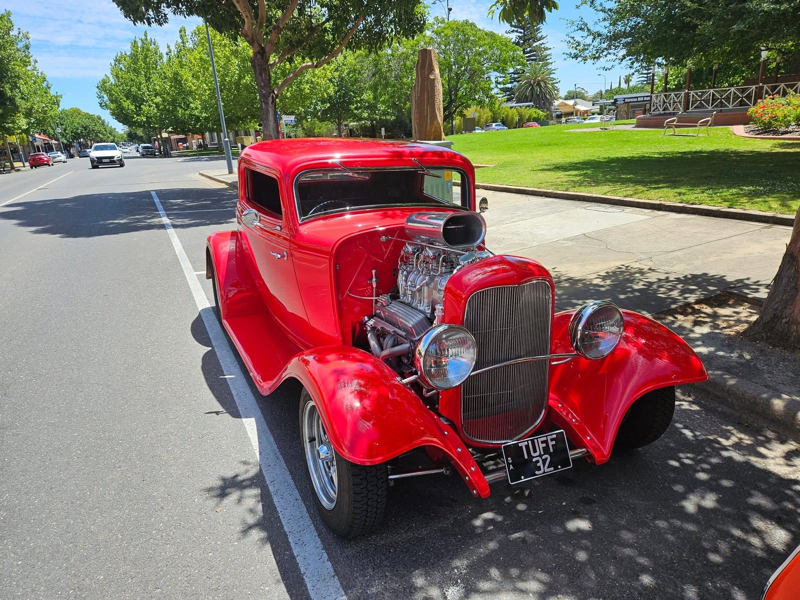 A classic car parked out the front of the diner
